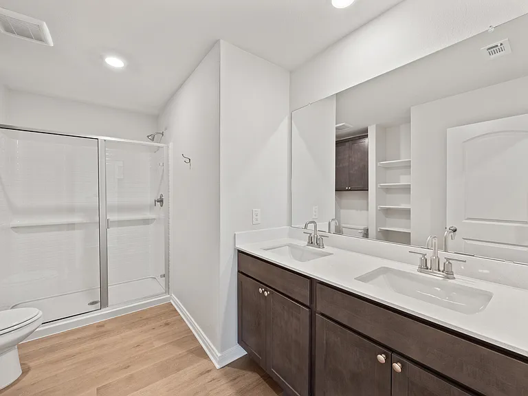 The master bathroom has a sprawling dual-sink vanity.