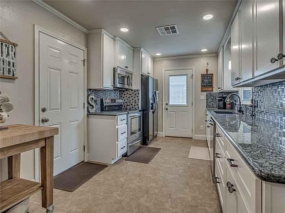 New kitchen cabinets, granite countertops, tile, sink, faucets, and all new appliances, including refrigerator and microwave!