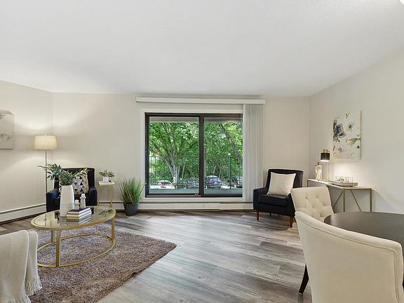 living room with view of walkout balcony