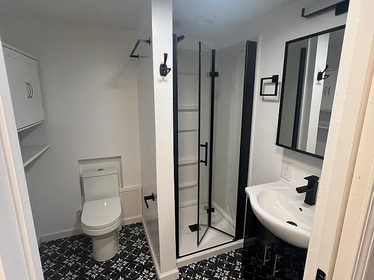 Lower-level bath with 36-inch walk-in shower 7 x 7