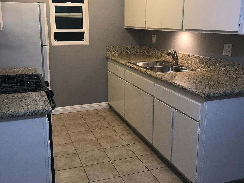 kitchen w/ granite counters & dining area