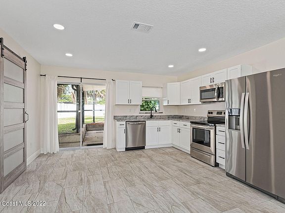 Kitchen And Exit To Pool