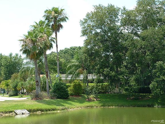 VIEW OF HOME ACROSS WATER