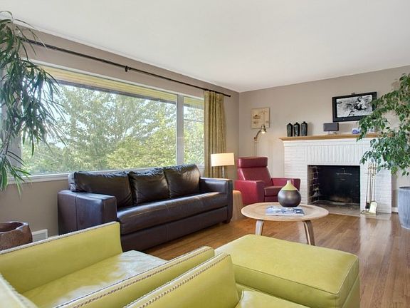 Refinished wood floors throughout main level. Picture windows for lovely view & peek of the Sound.