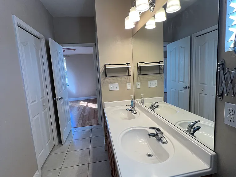 Master bathroom. Door to walk-in closet on left side