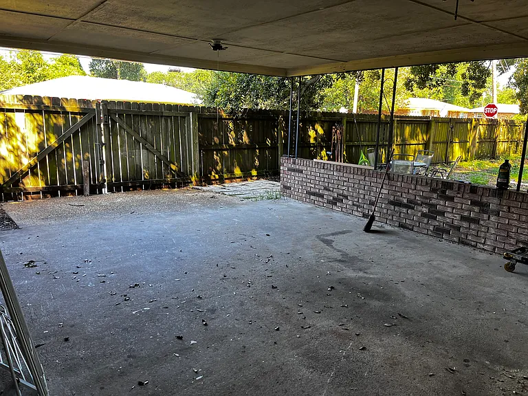 Fenced Backyard and carport