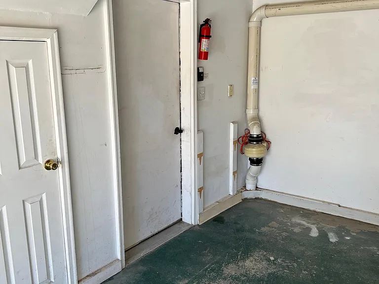 Private entrance from garage into apartment and under-stairs storage!