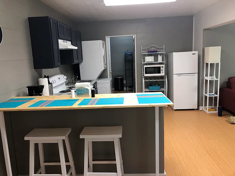 Kitchen with countertop eating; in unit washer/dryer