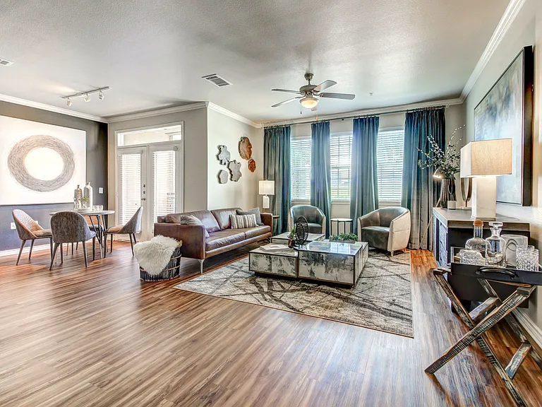 Open living room and dinning room area with faux wood flooring.