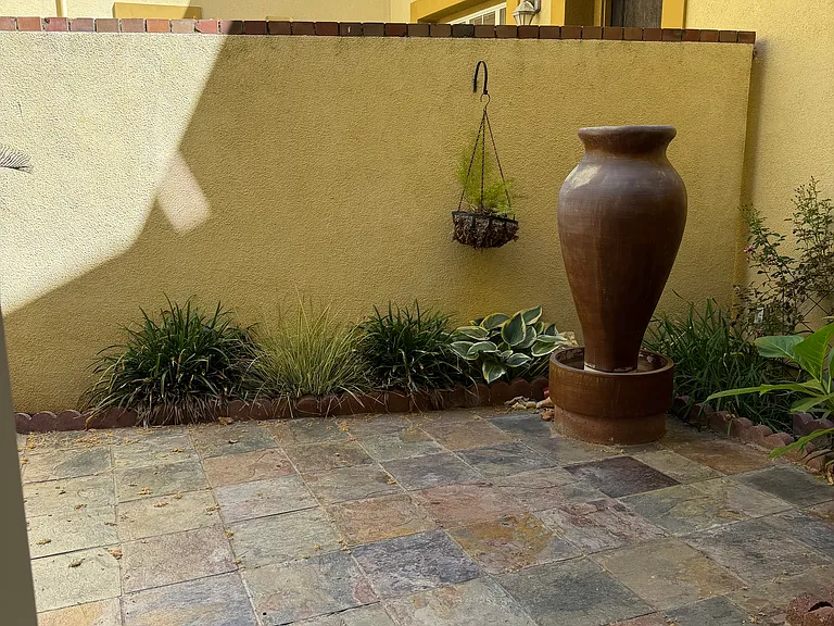 Sideyard - attached to living room with fountain