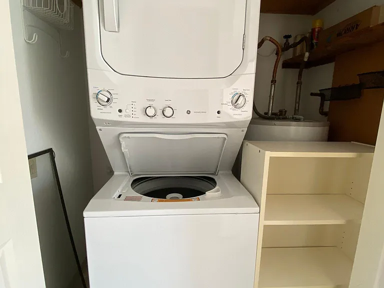 Stackable Washer/Dryer inside of the unit.