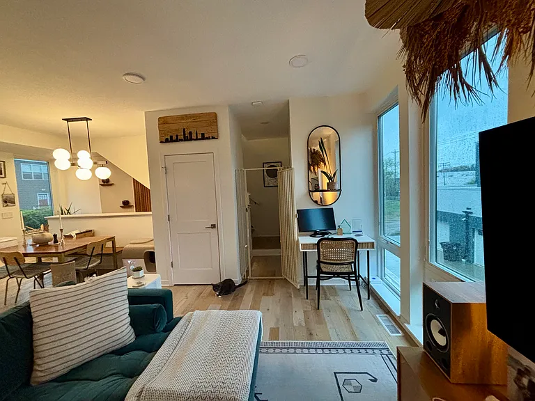 Main living space showing floor to ceiling windows