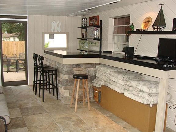 Built In Bar with Sink, Under lighting and Stack Stone Face.