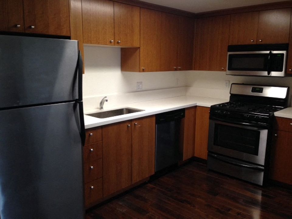 Louise Apartments kitchen area with appliances