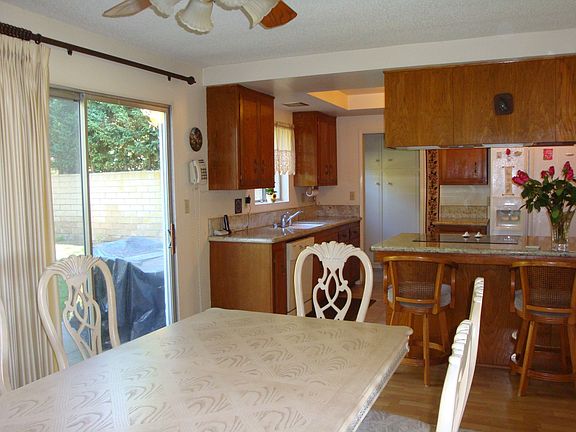 Dining room and kitchen leads to backyard.