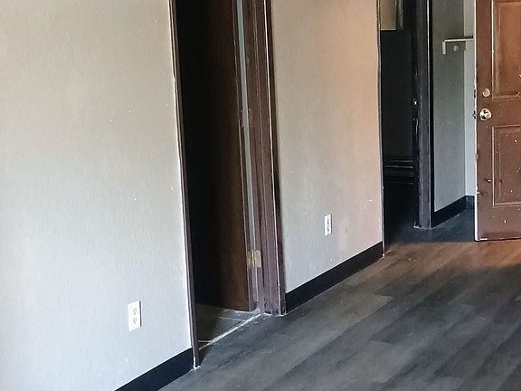 Main living looking at entry, bathroom and second bedroom.