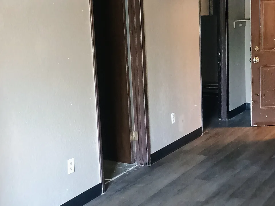 Main living looking at entry, bathroom and second bedroom.