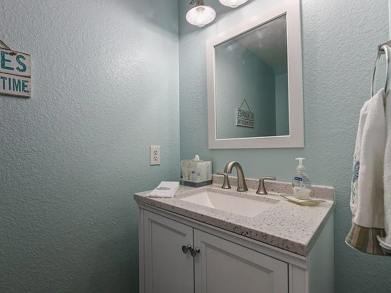 Half bath perfect for guests located downstairs.