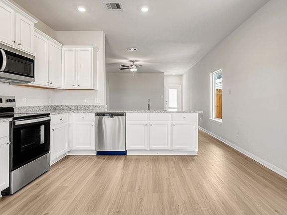 The kitchen overlooks the dining room