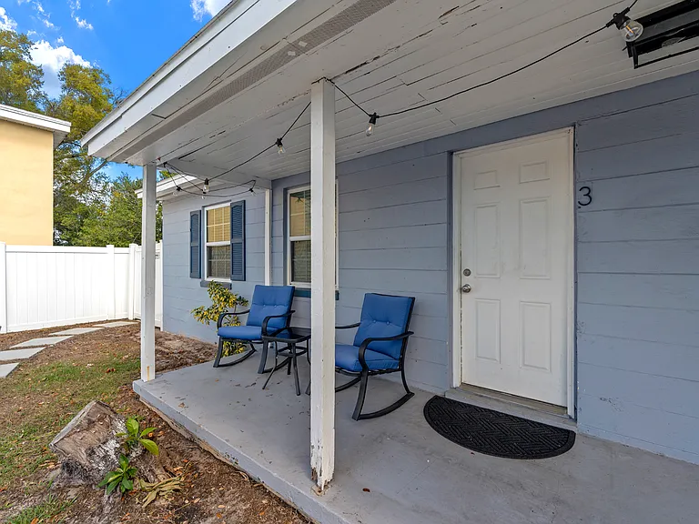 Front porch with porch chairs/table included to enjoy the fenced in backyard