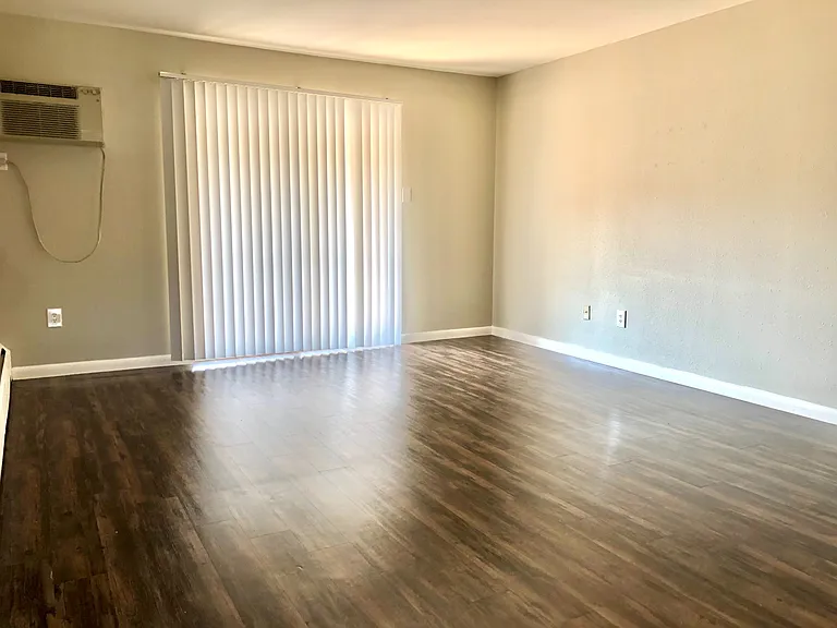 Experience open living in this bright space with stylish hardwood floors. Experience open living in this bright space with stylish hardwood floors.