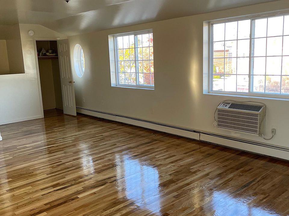 There are two large windows facing the front of the House in the Living Room and a smaller circular window.