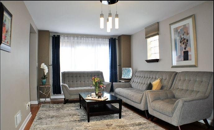 Old photo of previous tenants, now has new globe light fixture