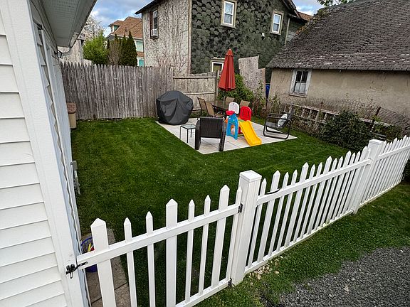 Fenced-in backyard and patio area.