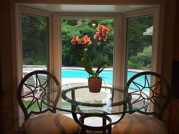 Morning coffee by the bay window overlooking the pool, anyone?br /