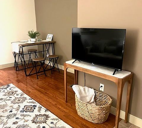Living room with dining table near kitchen