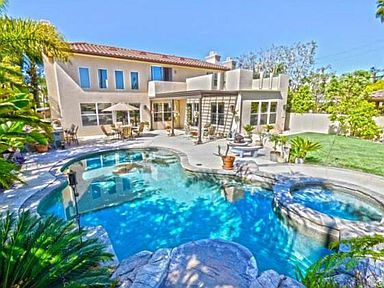 Tropical oasis in your own backyard. Pool, spa, and rock formati
