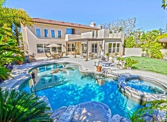 Tropical oasis in your own backyard. Pool, spa, and rock formati