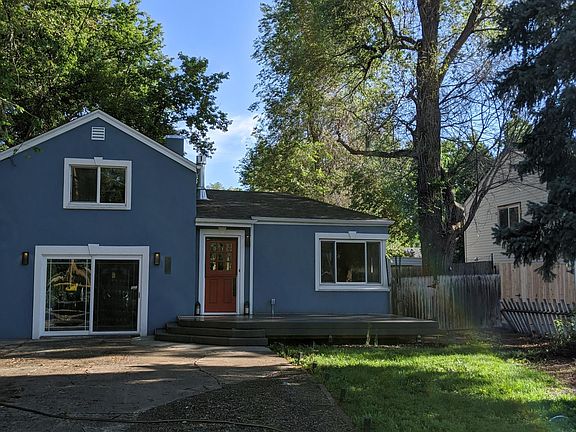 Front of house with extended driveway.