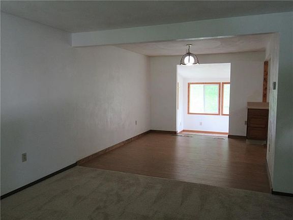 Living Room/Dining room and pass way all lead to inviting sunroom