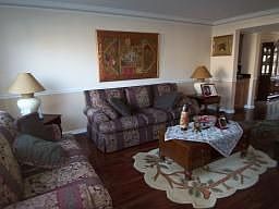 Hard wood floors, lots of natural sunlight, crown molding & chair rail 