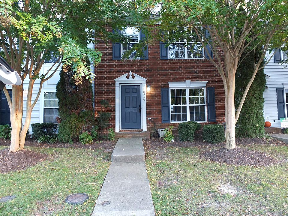 Brick Front. Two reserved parking spots in front of the townhouse