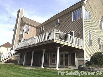 Large Deck with Stone Patio on Ground Level