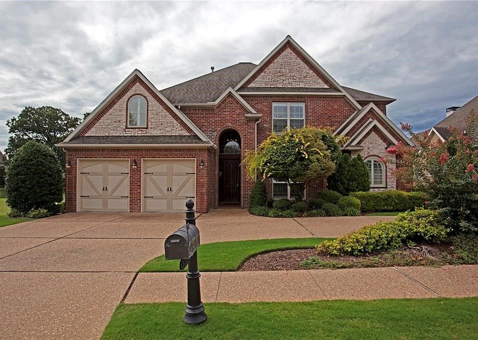 Wonderful curb appeal. Patterned concrete, circular driveway provides ample parking for your guests