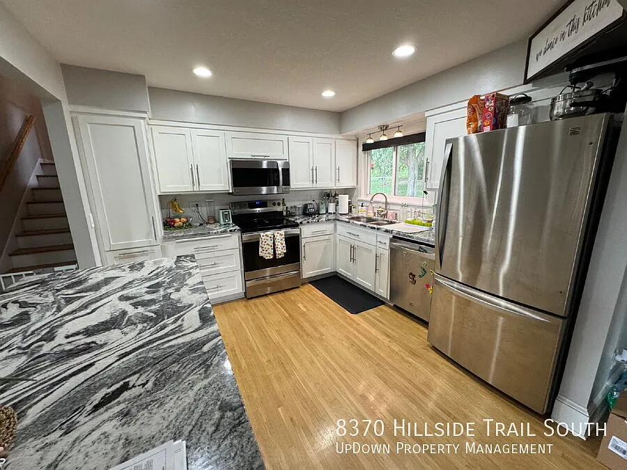 "Experience Elegant Living: 4-Bed Home with Granite Touches & Cozy Fireplace in Cottage Grove!" — Photo 4