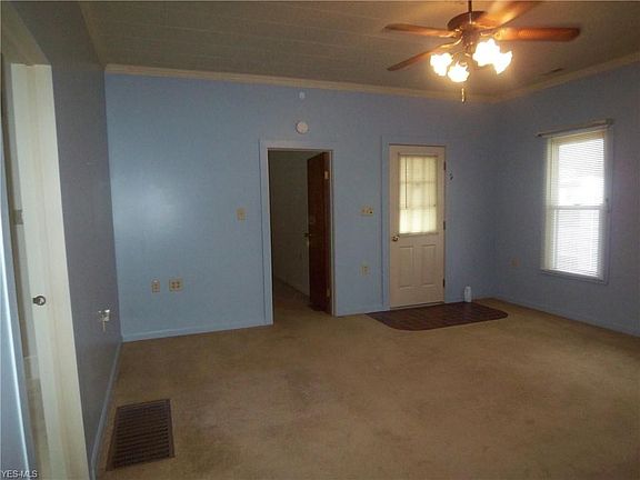 The living room is spacious enough to accommodate a sectional.....