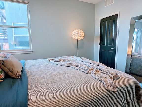 closet through dark door to the right. Up-down black out shades provide privacy day or night while still allowing sky in if you desire