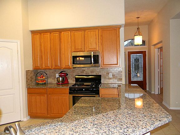 Stunning kitchen opens to den and is ready to entertain family and friends.