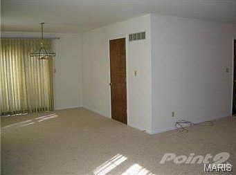 LIVING ROOM W/VIEW OF DINING AREA