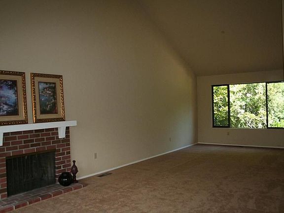 Formal Living room boasts vaulted ceilings and formal dining room 