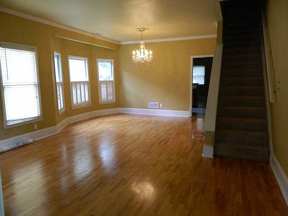 Large living room with beautiful hardwood floors and lots of