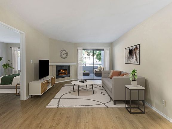 Renovated Package I living room with hard surface flooring