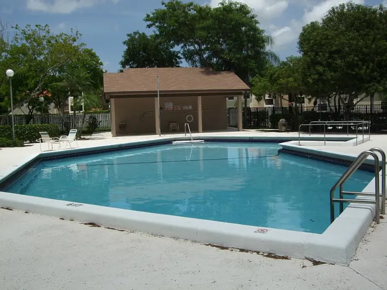 Fenced in community pool with bathrooms- must have a key to enter (included in rental)