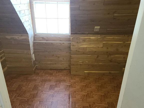 Giant Walk in Cedar Closet off Living Room with window.