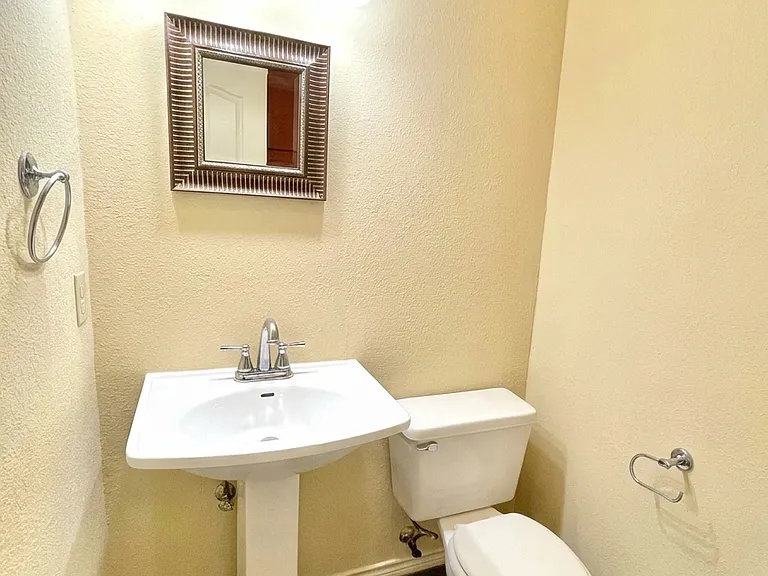 Half Bath next to Kitchen & Living Room.