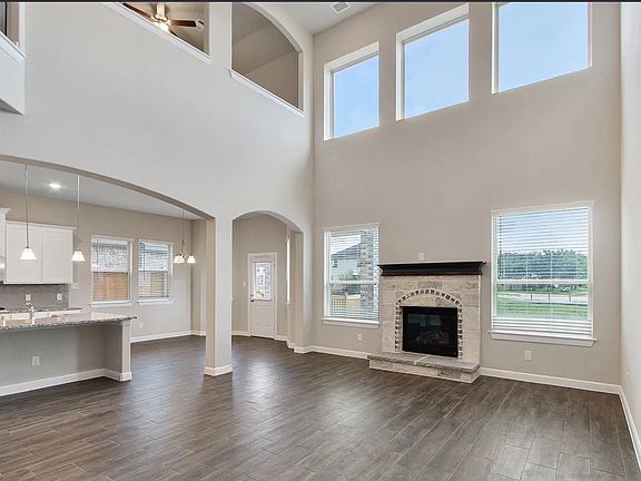 Another view of the living room with fireplace and lake view